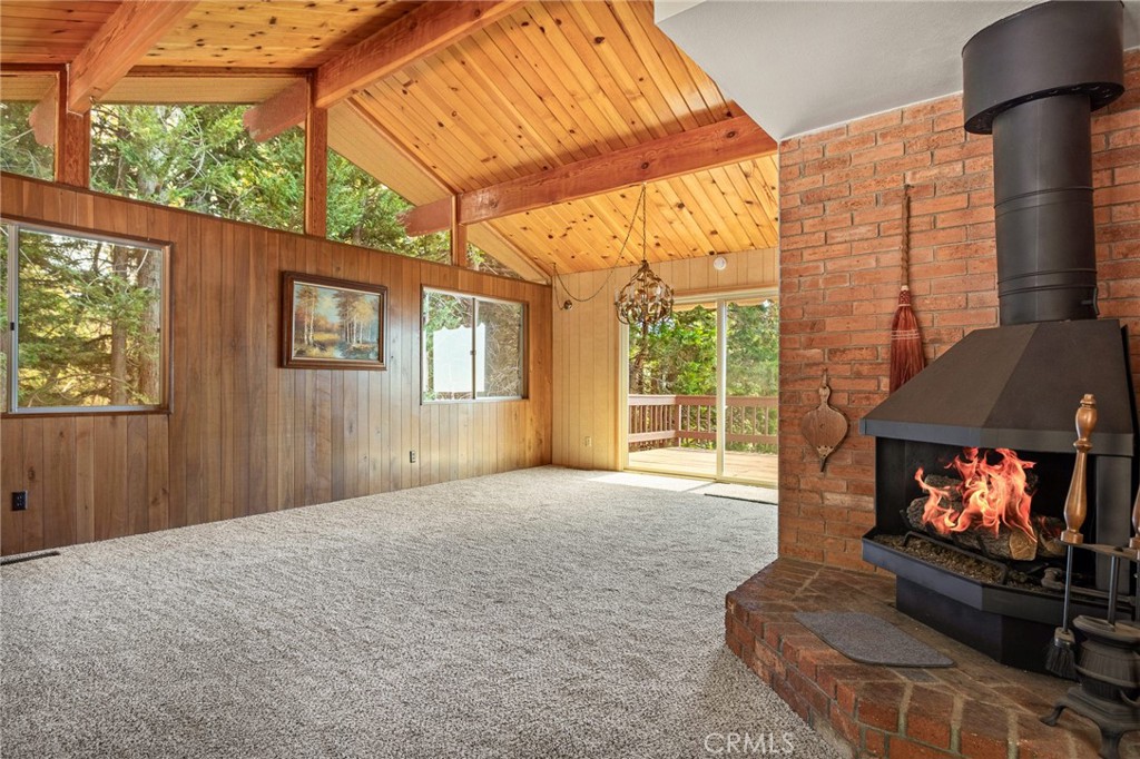 a living room with furniture a window and a fireplace