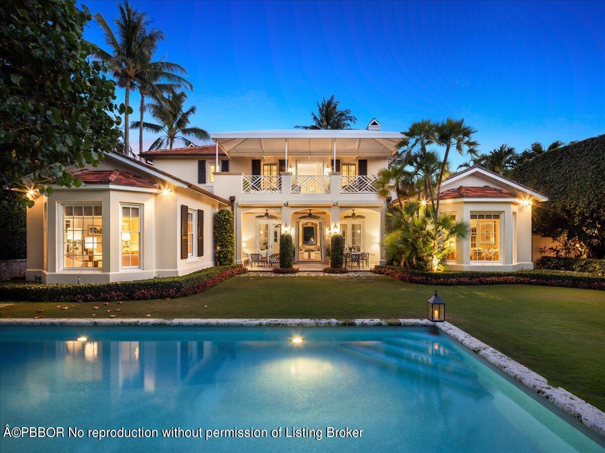 a front view of a house with swimming pool