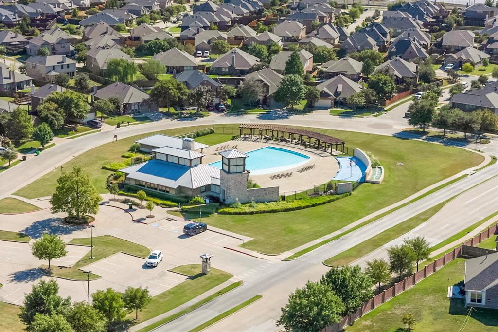 an aerial view of a house with a swimming pool