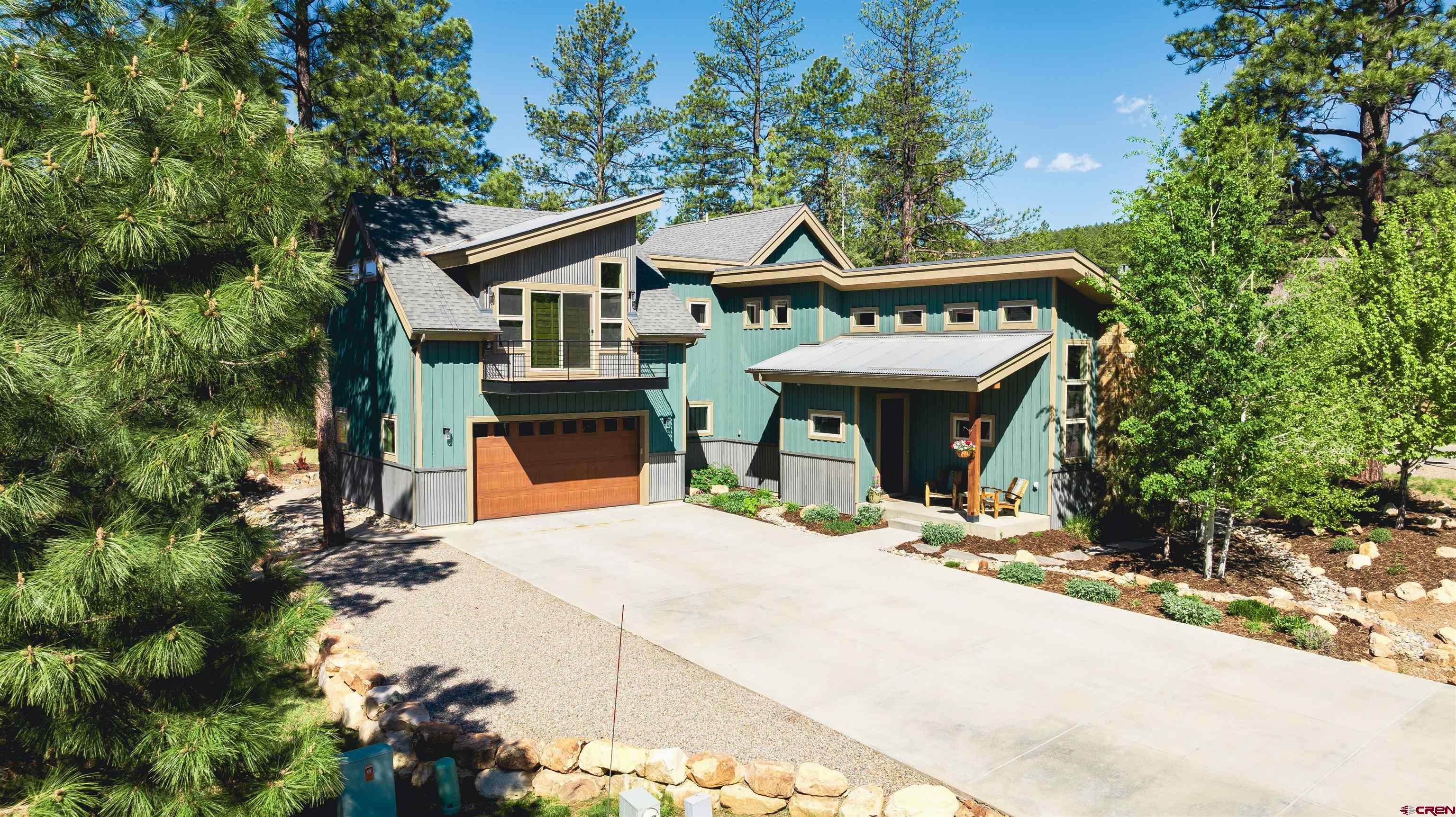 a view of house with outdoor seating and yard