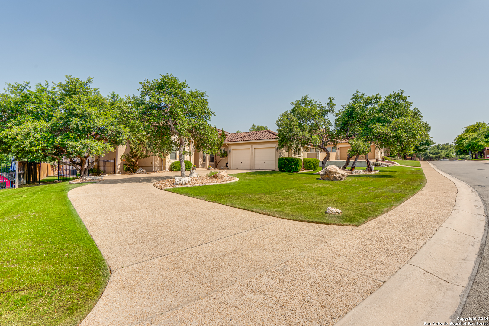 a view of a swimming pool with a yard