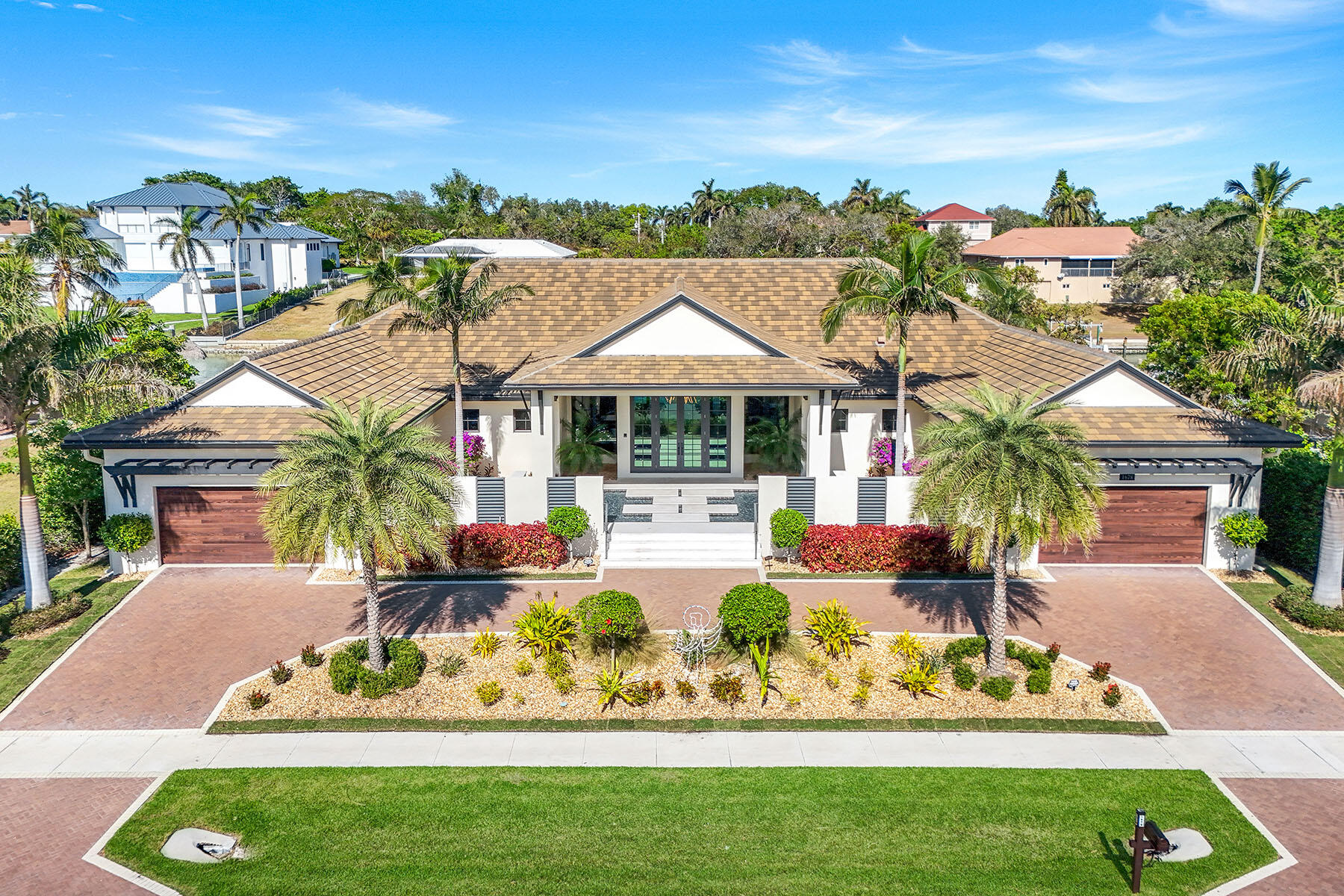 a front view of house with yard and outdoor seating