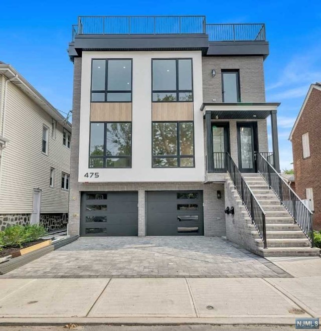 a front view of a house with a garage