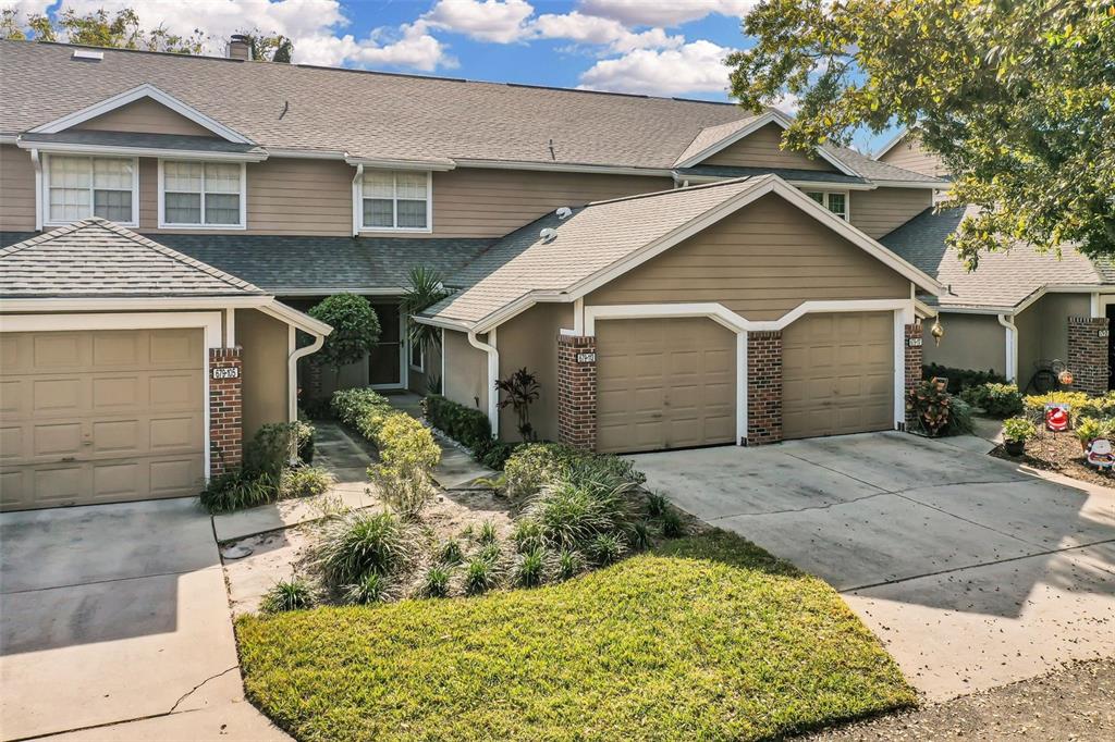 a view of a house with a yard