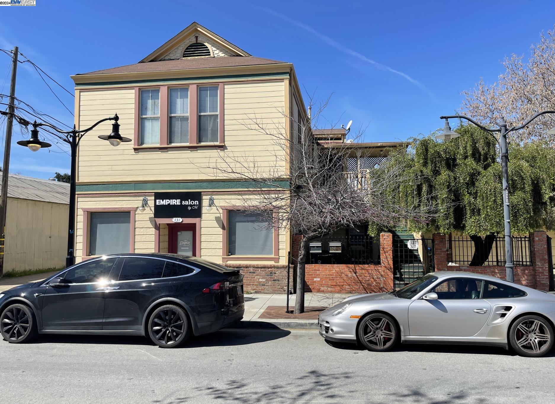 a front view of a house with parking space