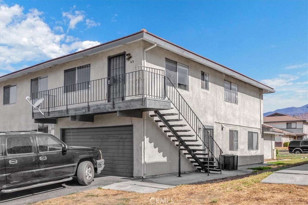 a front view of a house with parking space