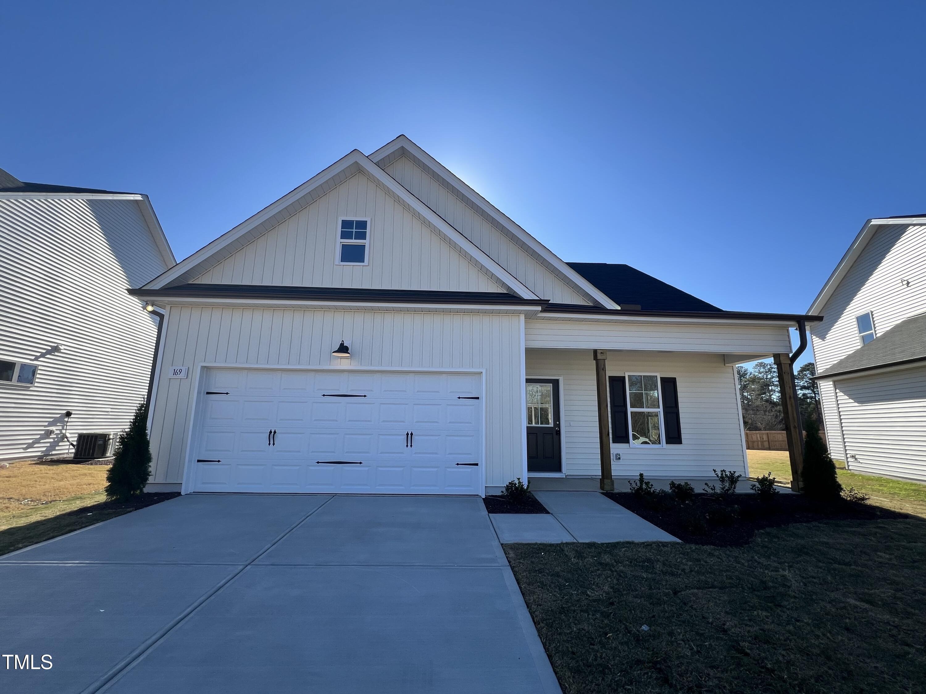 a front view of a house with a garage