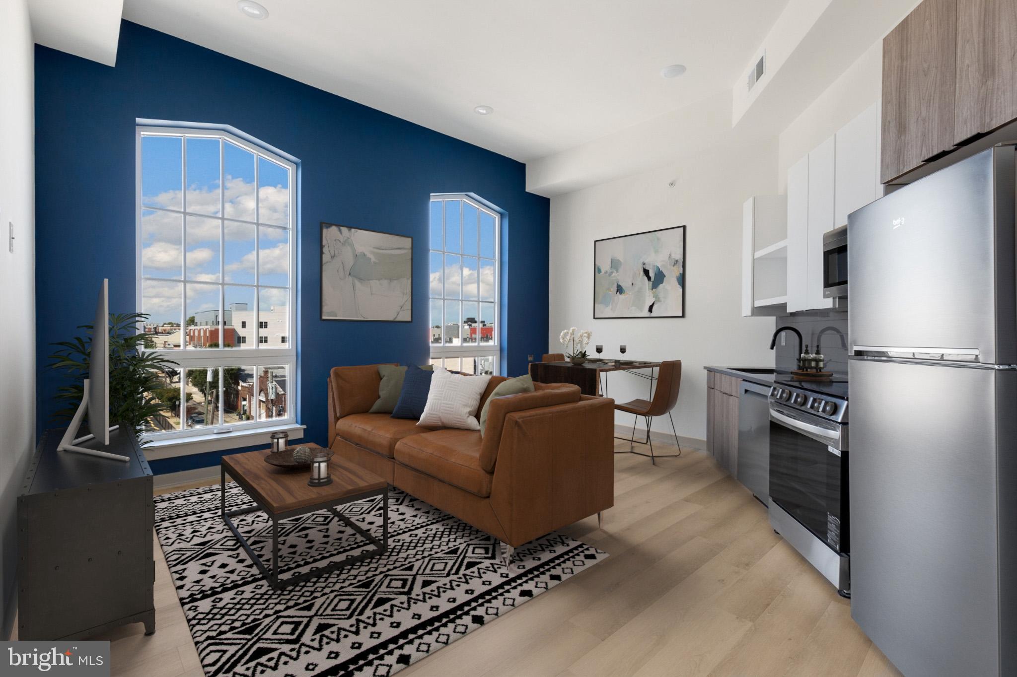 a living room with furniture windows and a fireplace