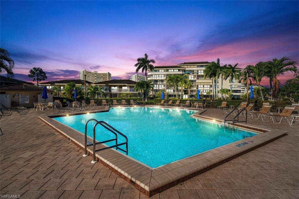 a view of a swimming pool and a chairs