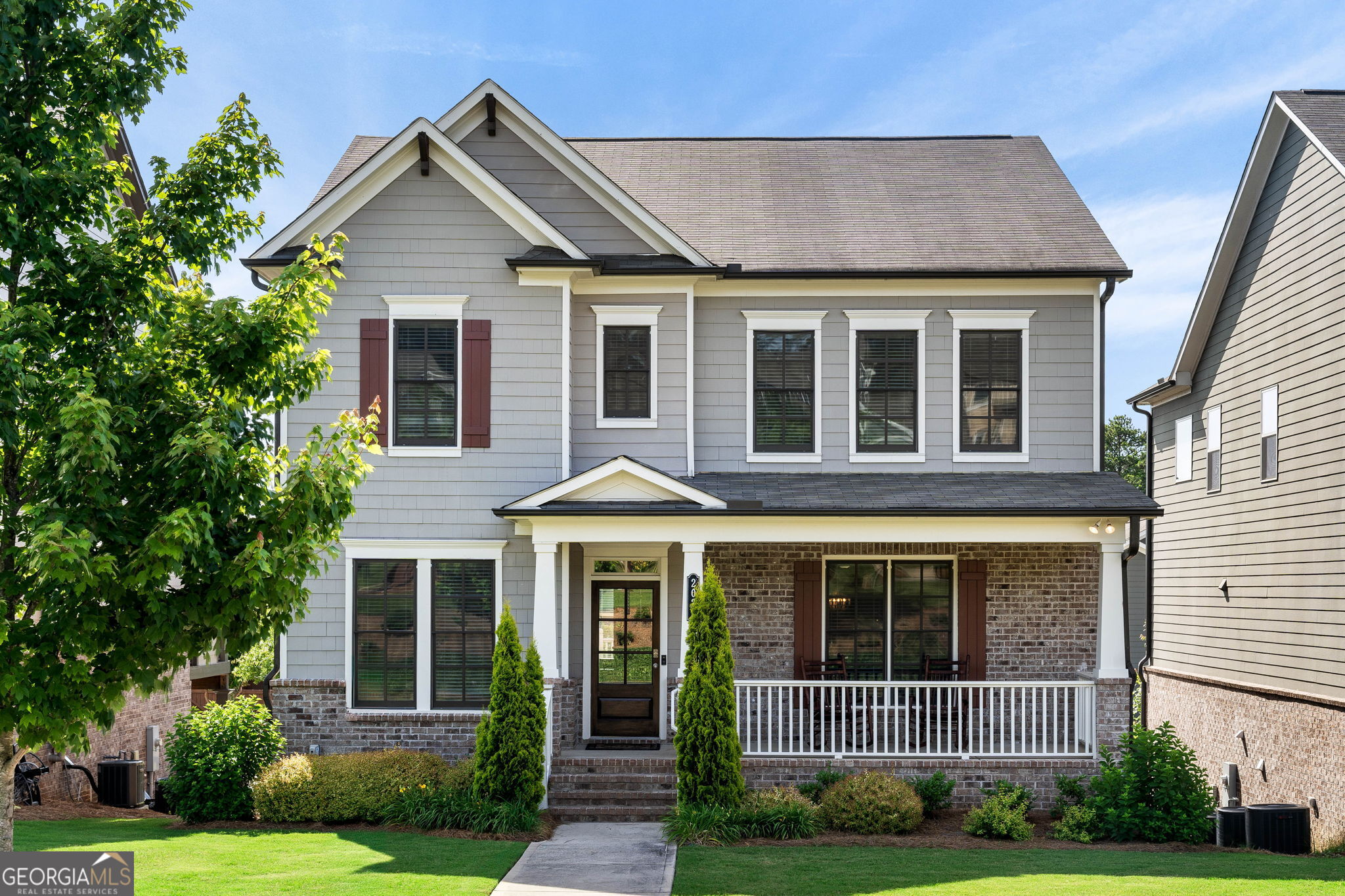 a front view of a house with garden