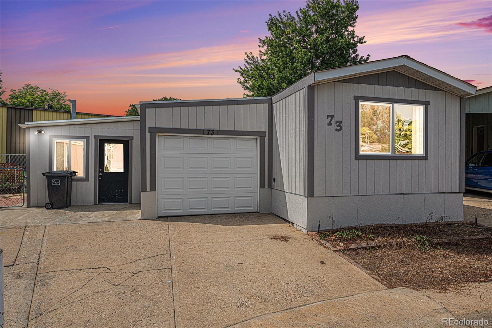 a front view of a house with garage