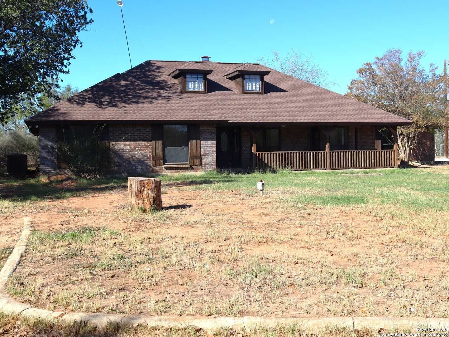 a house with trees in the background