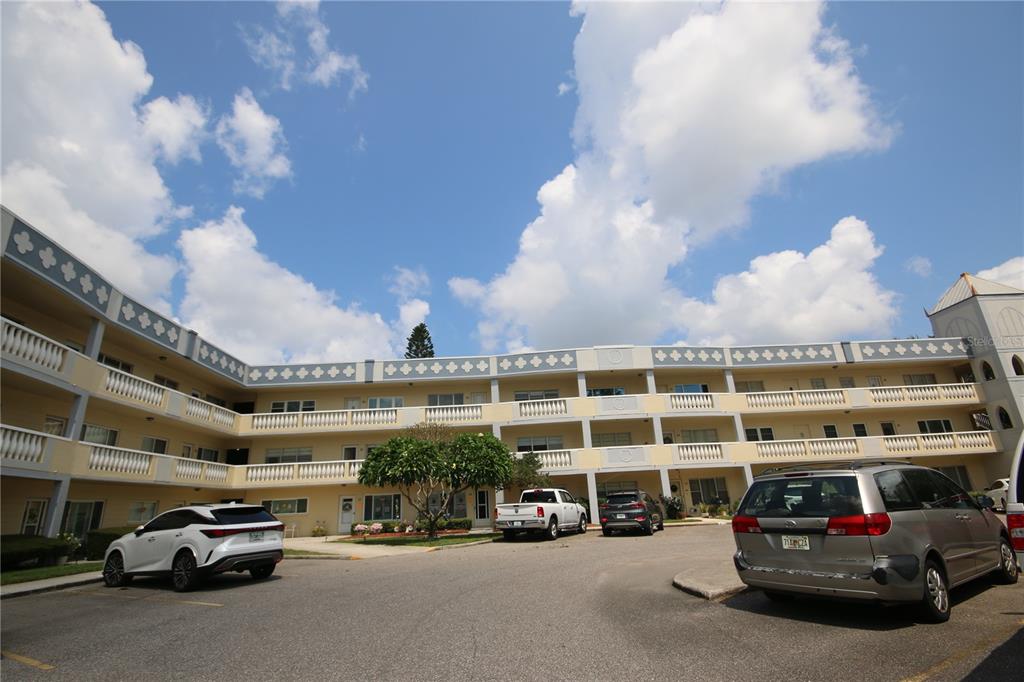 a view of a cars parked in front of a building