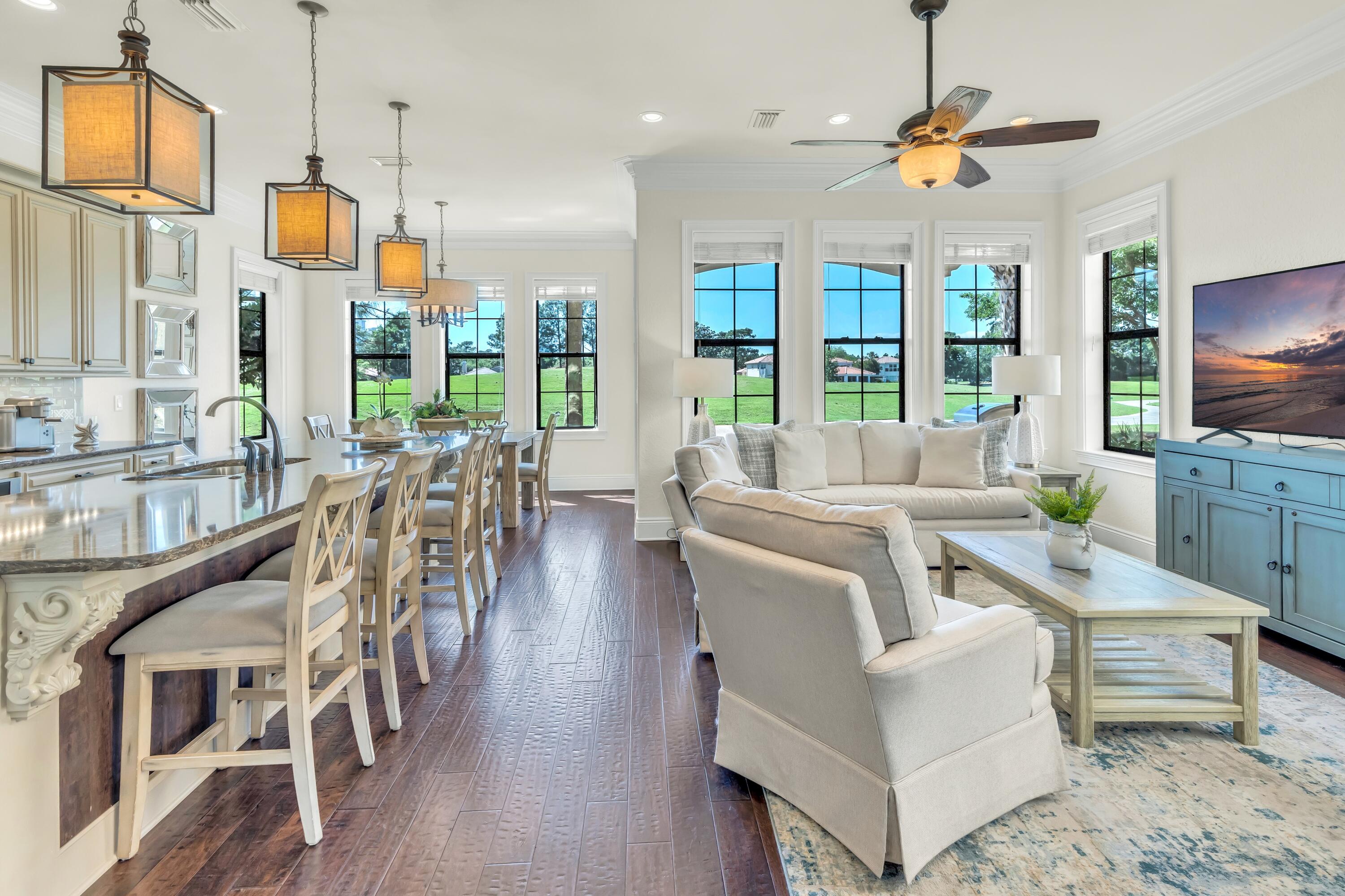 a living room with furniture wooden floor and a flat screen tv