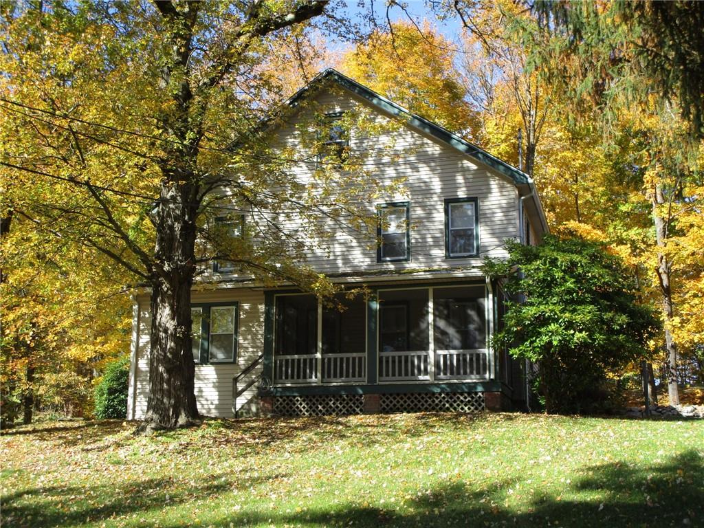 Quiet country setting with enclosed front porch.