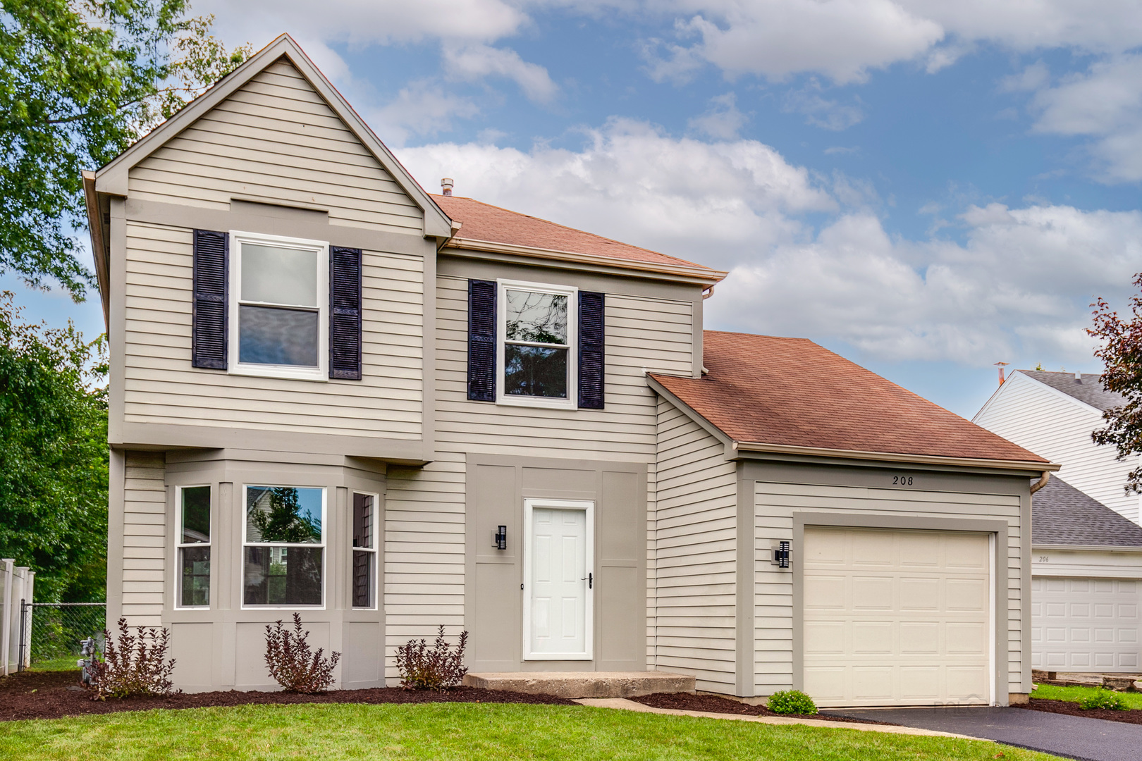 a view of house with yard