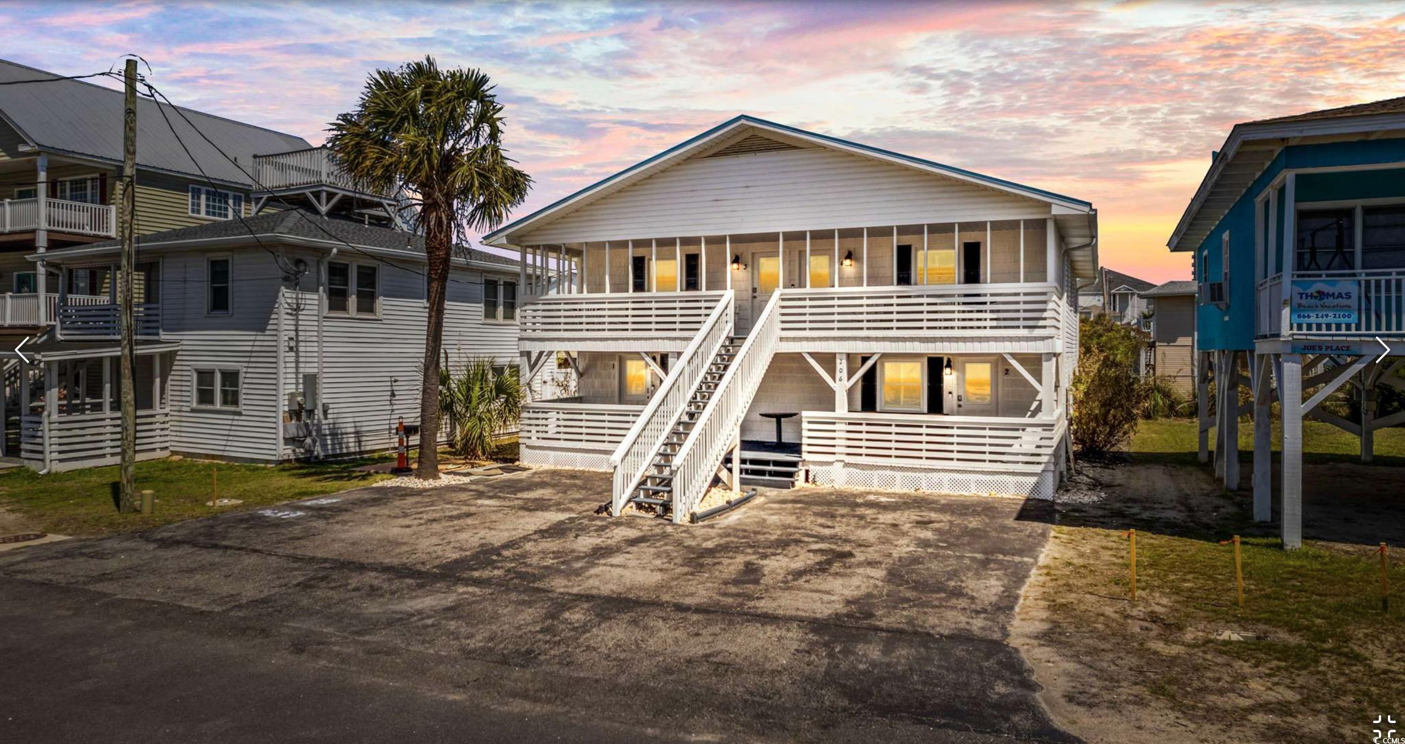 View of front of house featuring a balcony