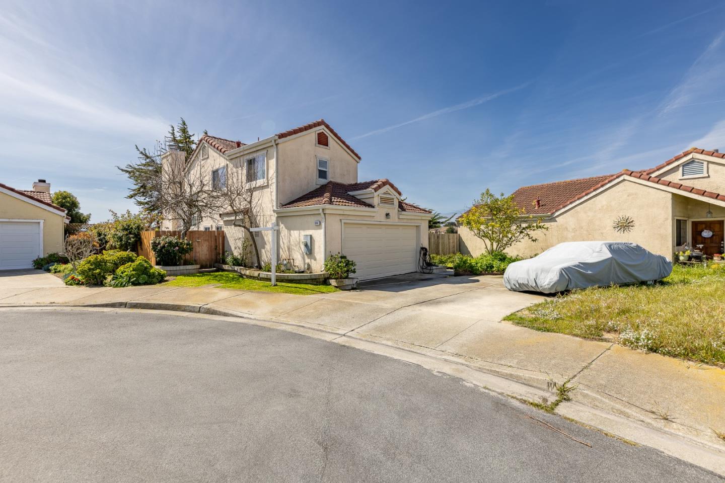 a view of a house with a yard and garage