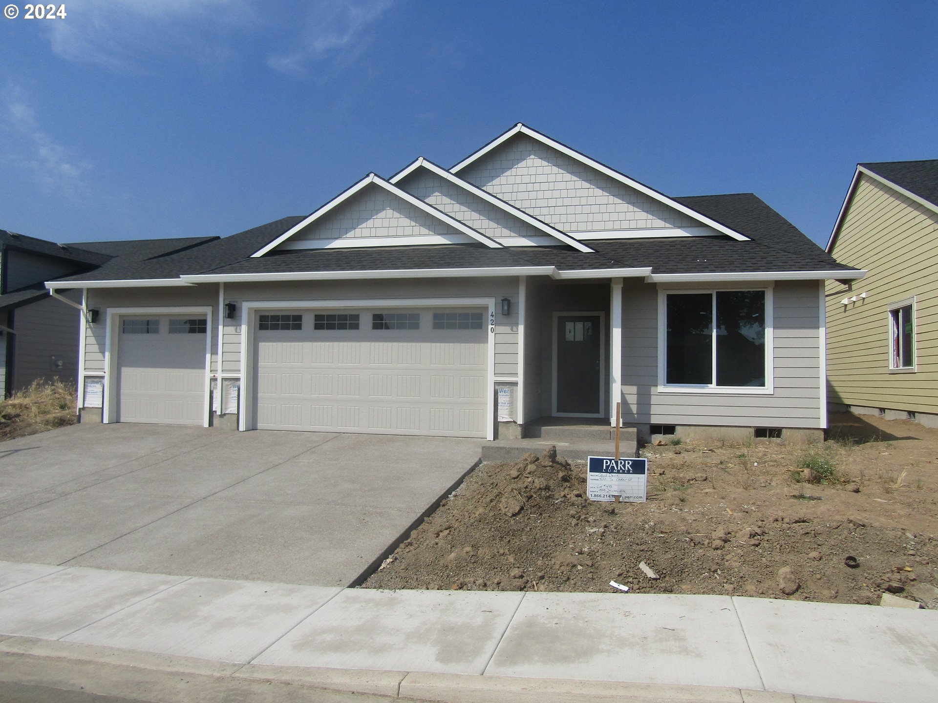 a front view of a house with yard