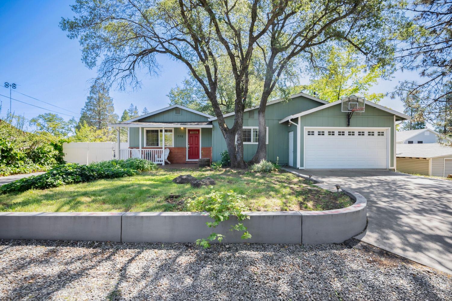 a front view of a house with garden