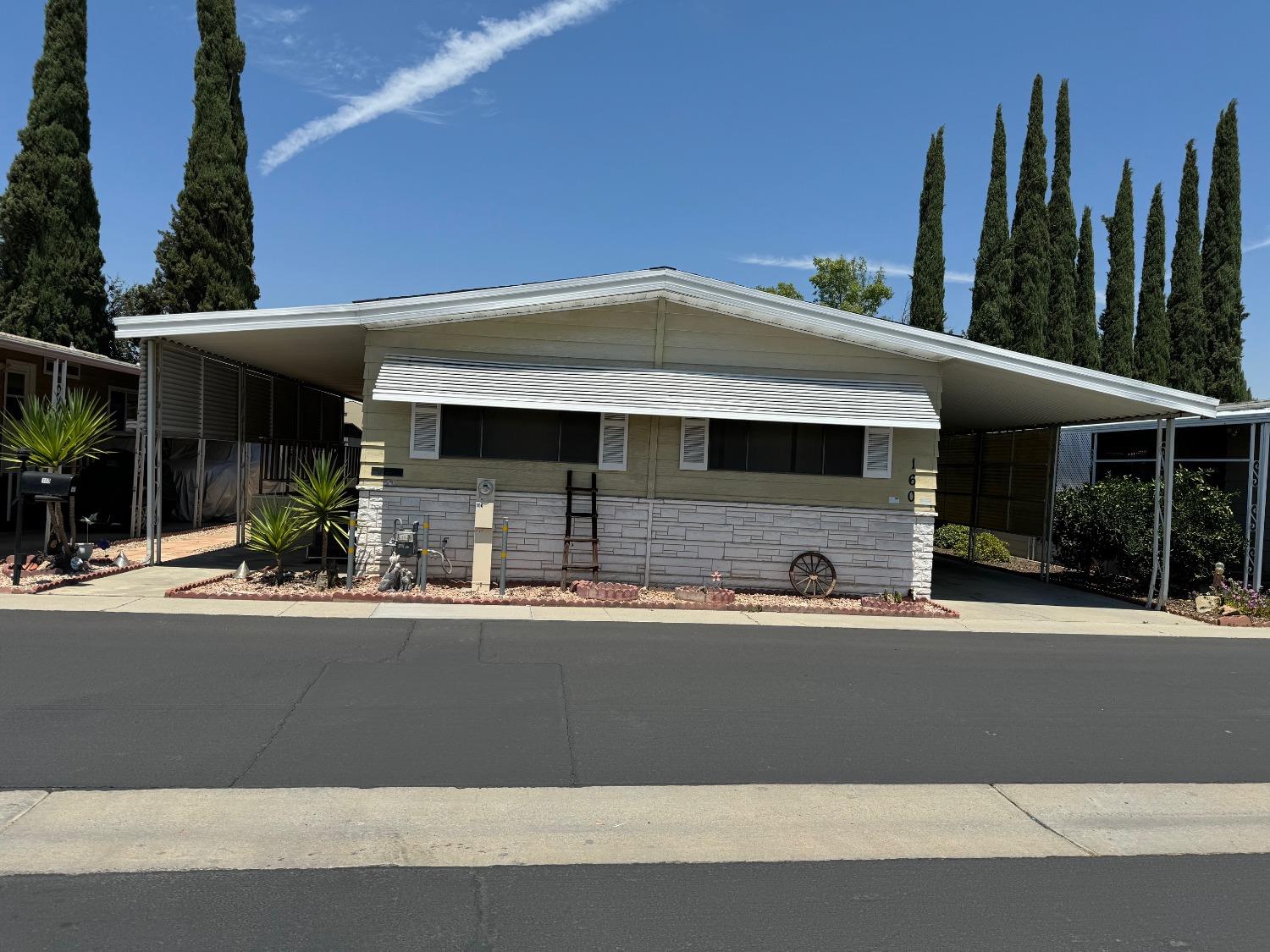 a front view of a house with yard