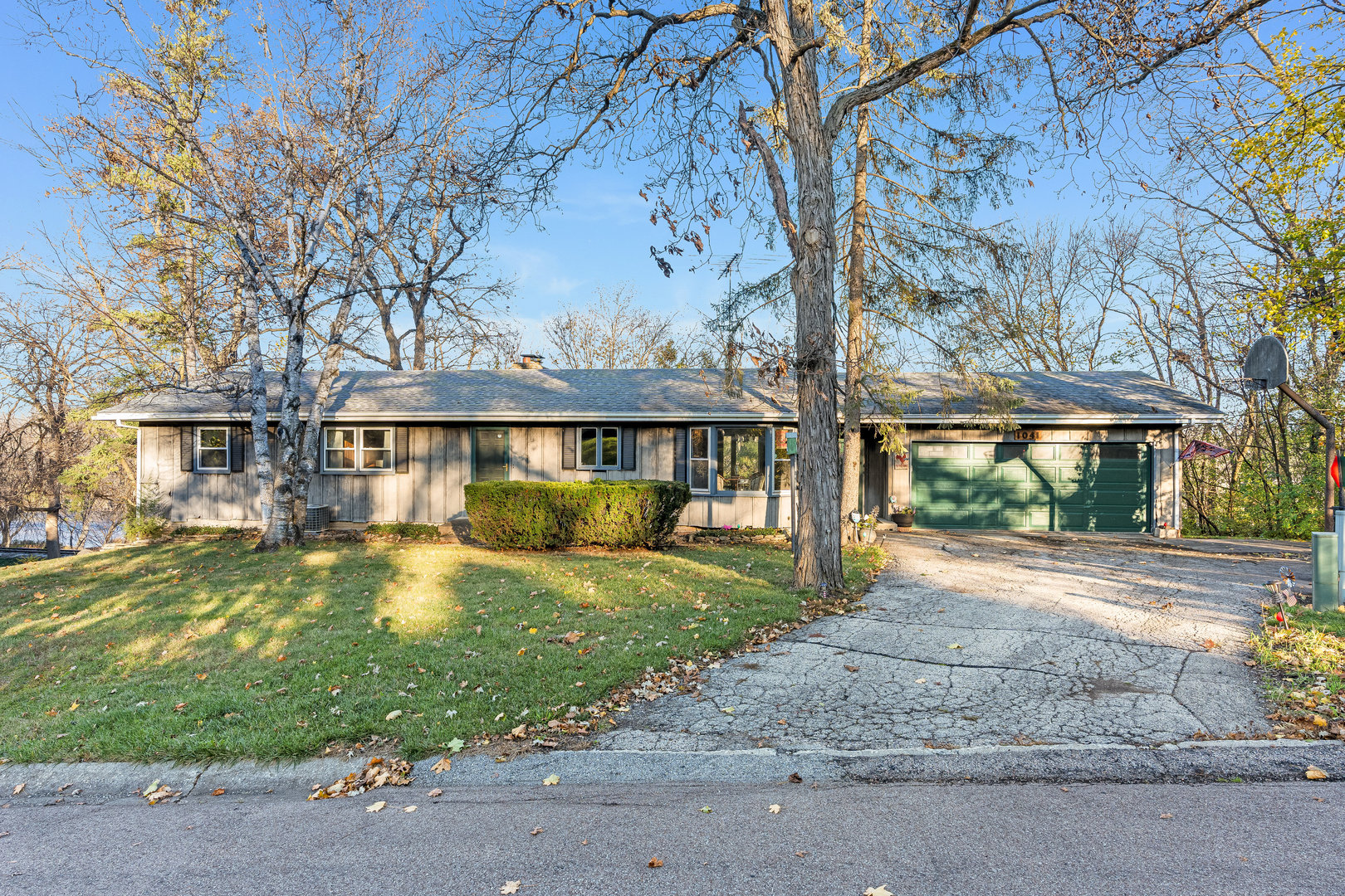 a front view of a house with a yard and porch