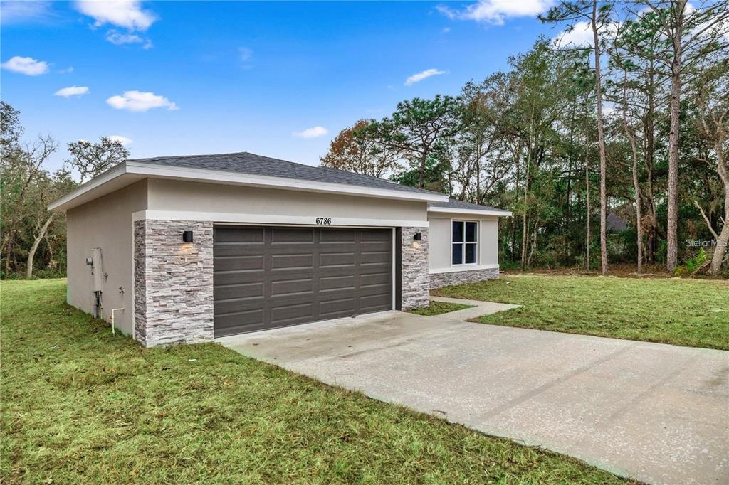 front view of a house with a yard