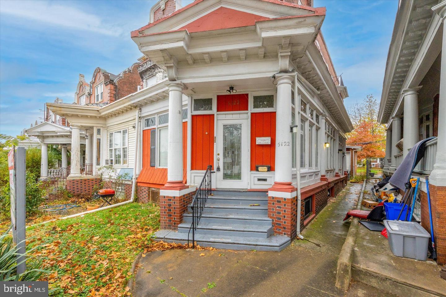 a front view of house with outdoor seating