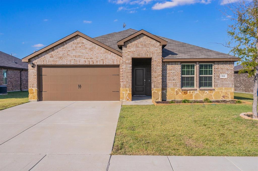 front view of a house with a yard