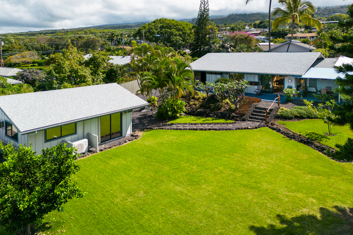 Welcome to Orchid Hale!  Aerial view showing the immaculate yard and both dwellings.  Main dwelling has 1388 sq ft of interior living space and 280 sq ft of covered lanai, 360 sq ft of open patio. Guest house has 480 sq ft.