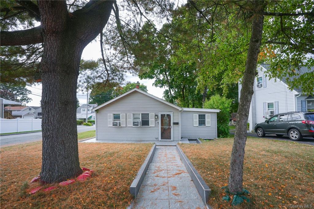 front view of a house with a yard