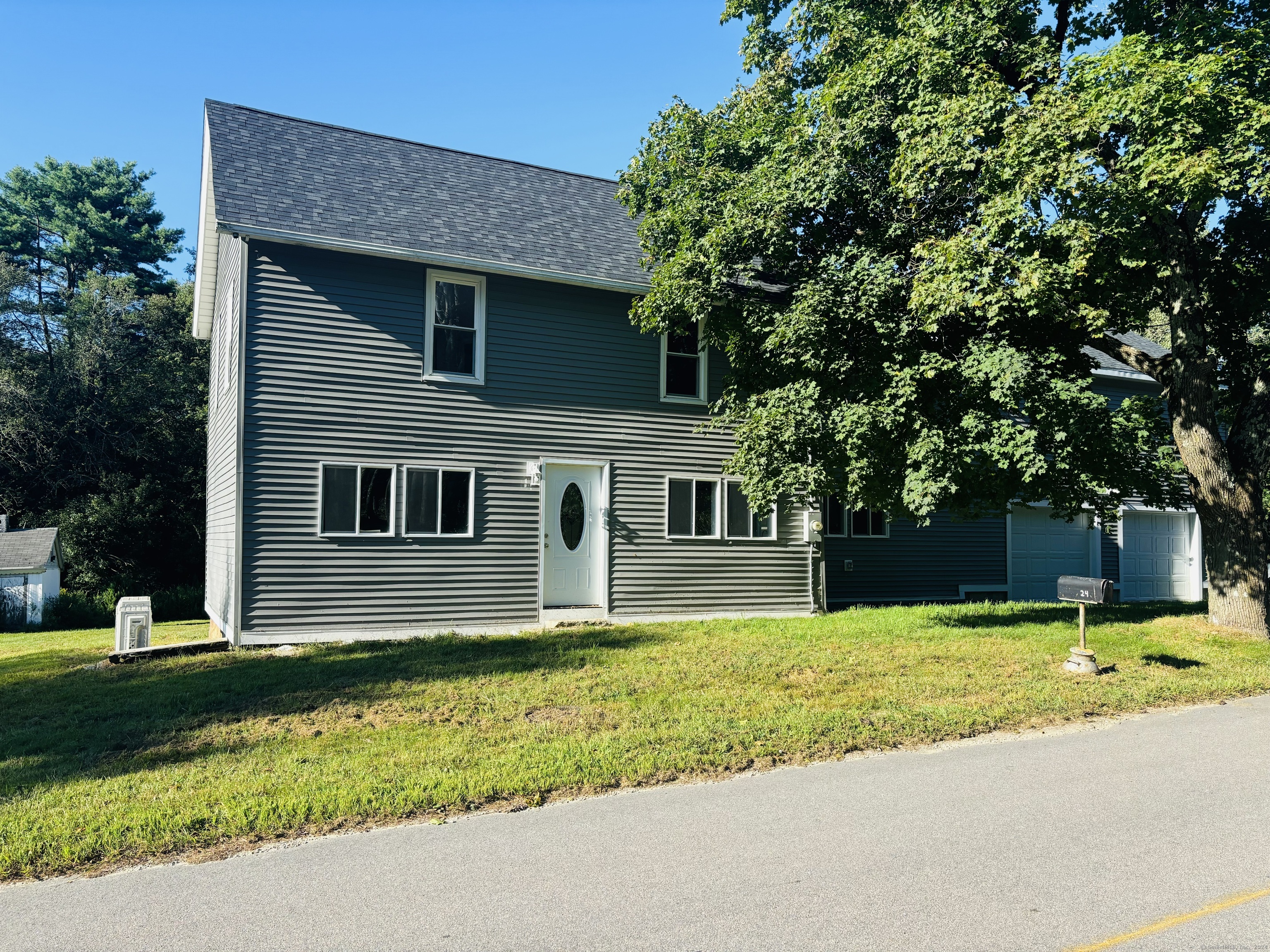 a view of a house with a yard