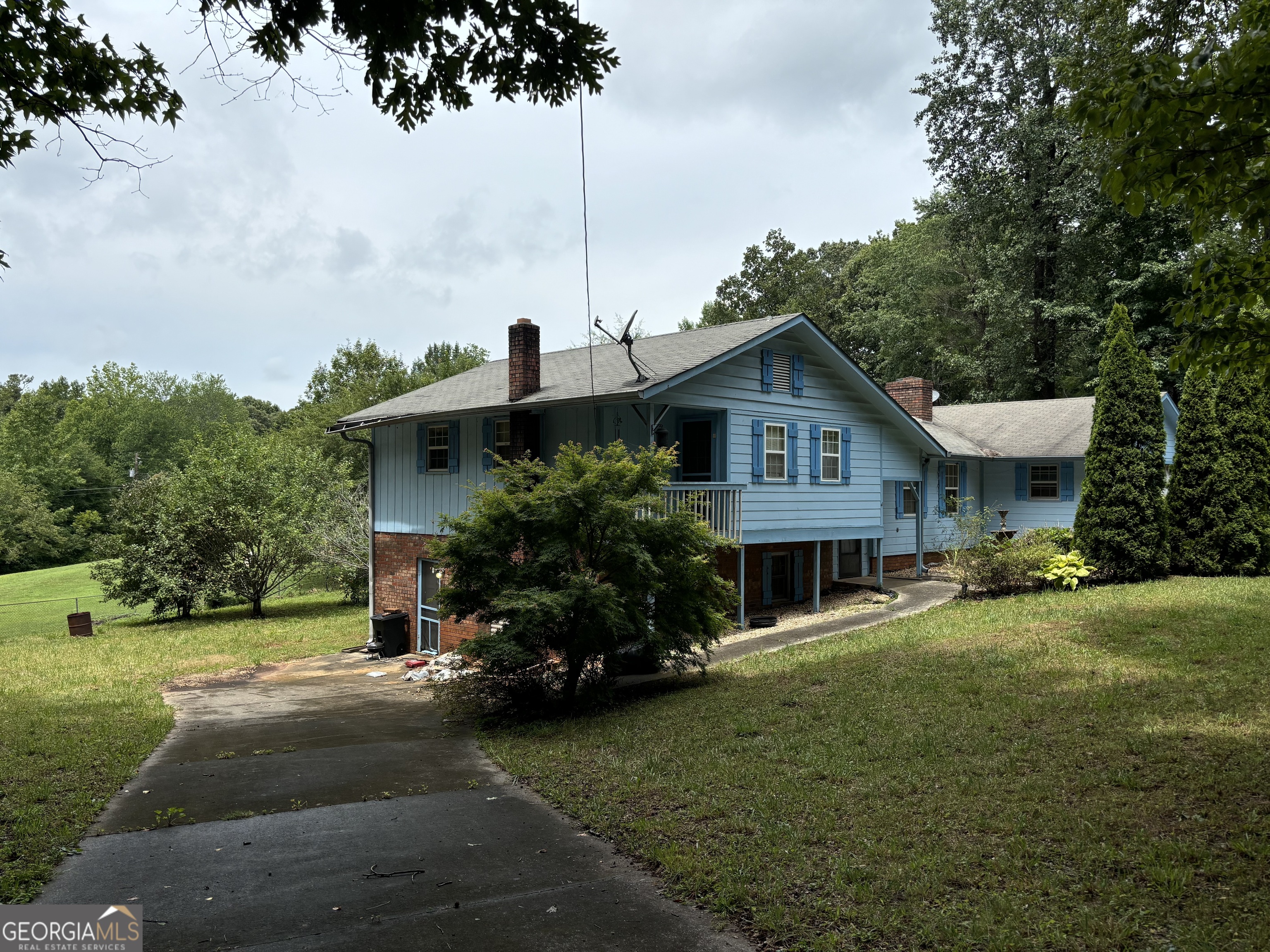 a front view of a house with garden