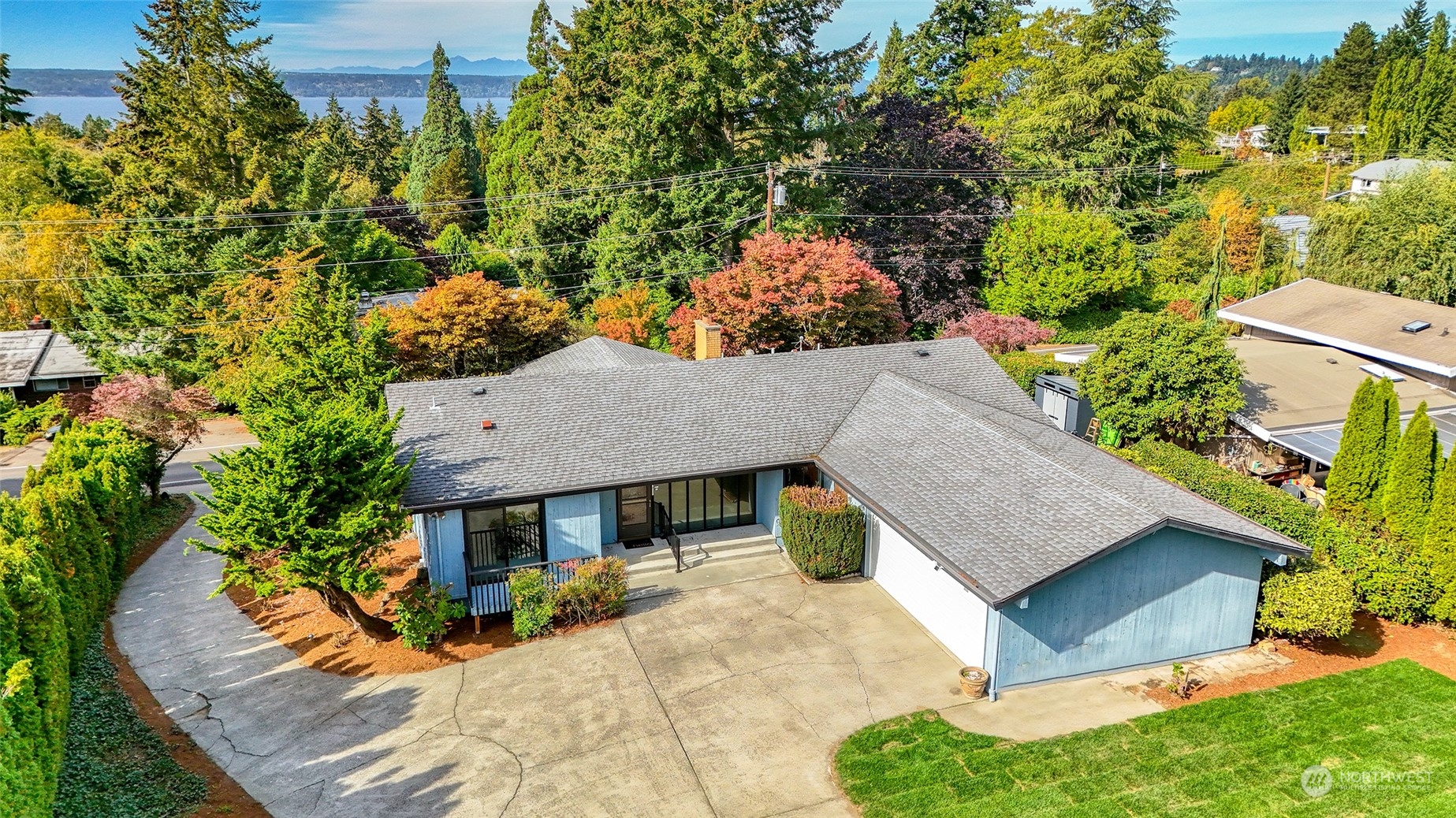 an aerial view of a house with a yard and balcony