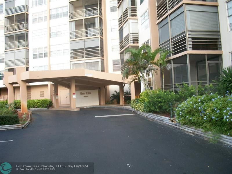 a front view of a building with a street