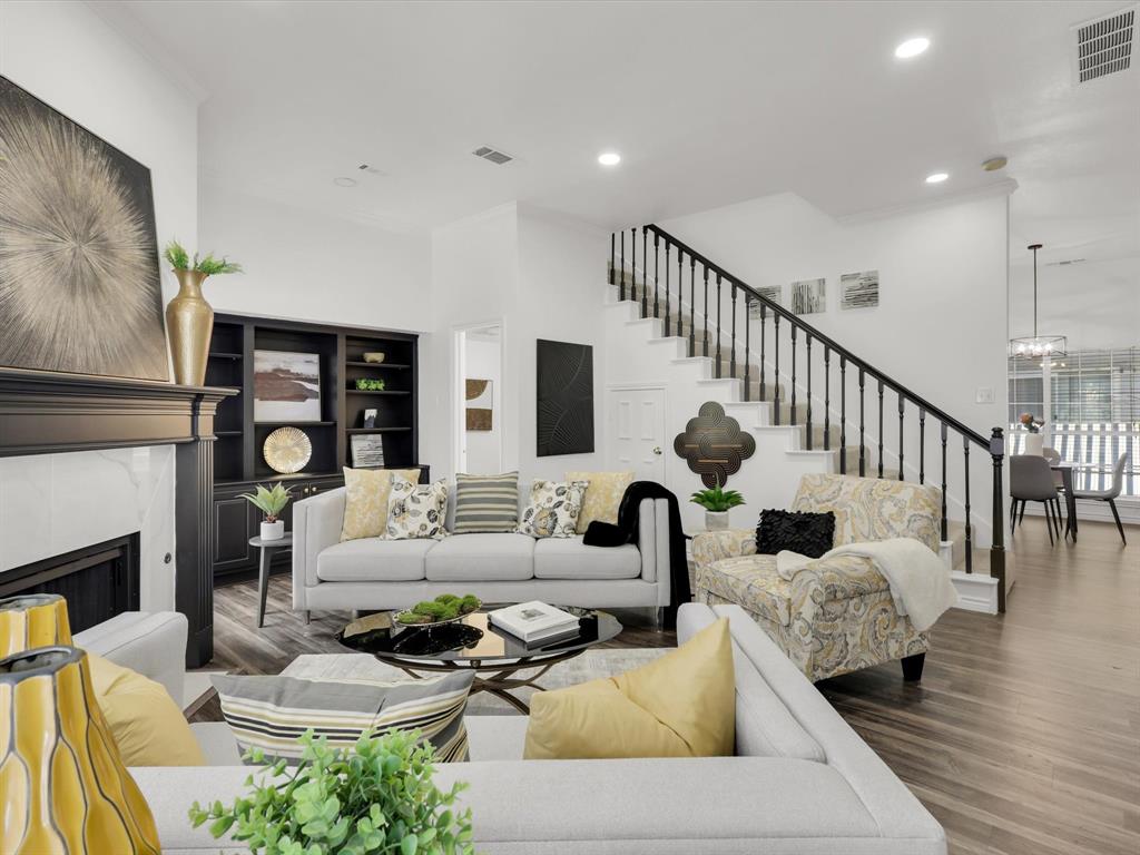 Living Room opens to staircase and dining room.