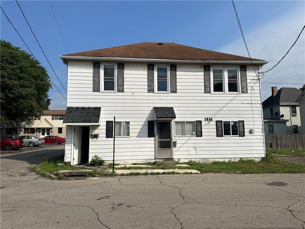 a front view of a house with garage