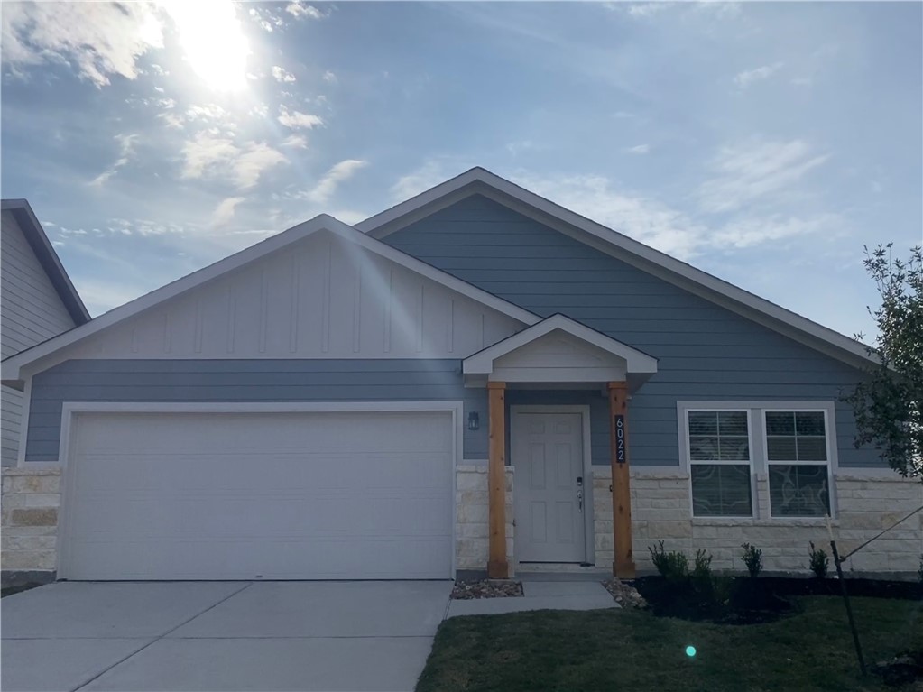 View of front facade featuring a garage