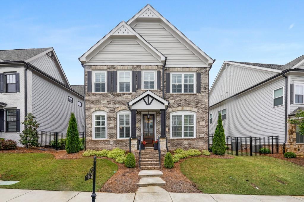 a front view of a house with a yard