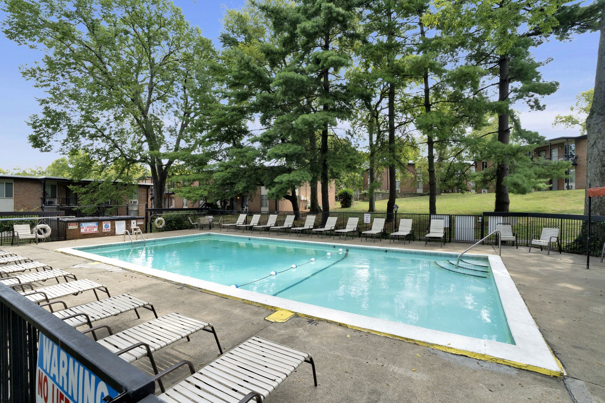 a view of a swimming pool with lounge chair