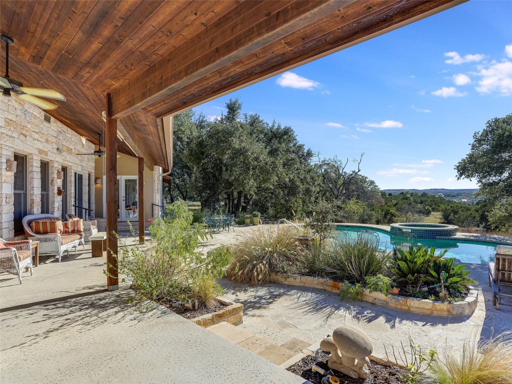 a view of backyard with outdoor seating and green space