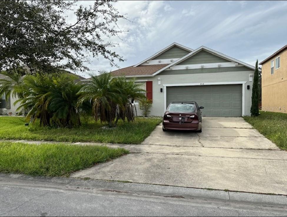 a car parked in front of a house