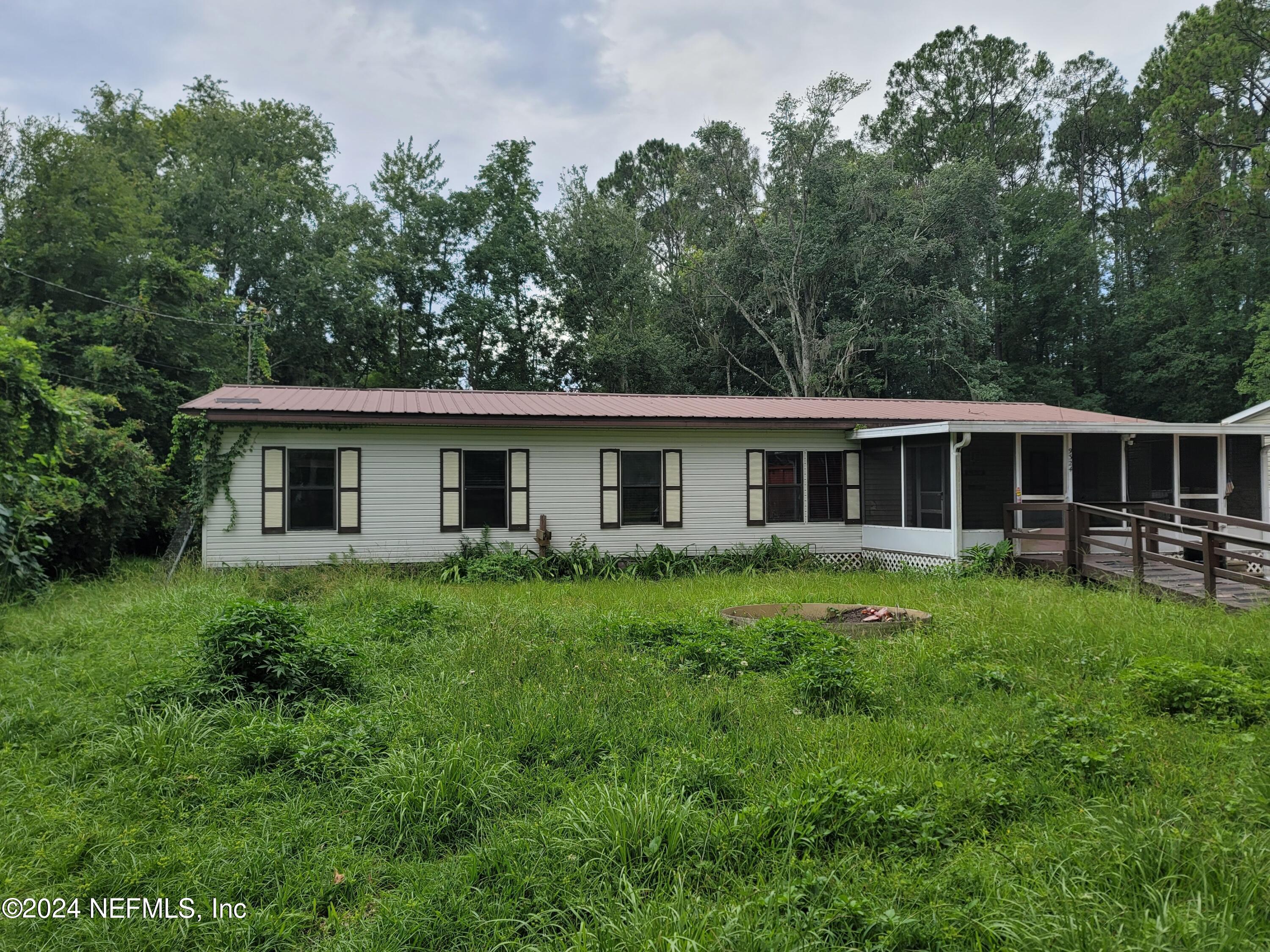 a front of a house with a garden