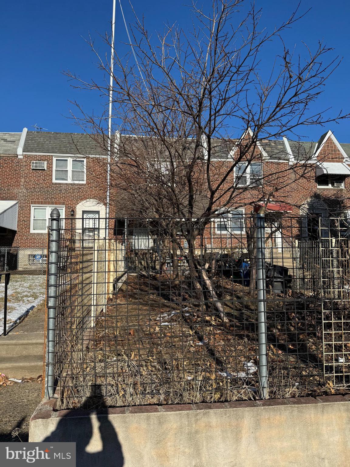 a view of a house with a street