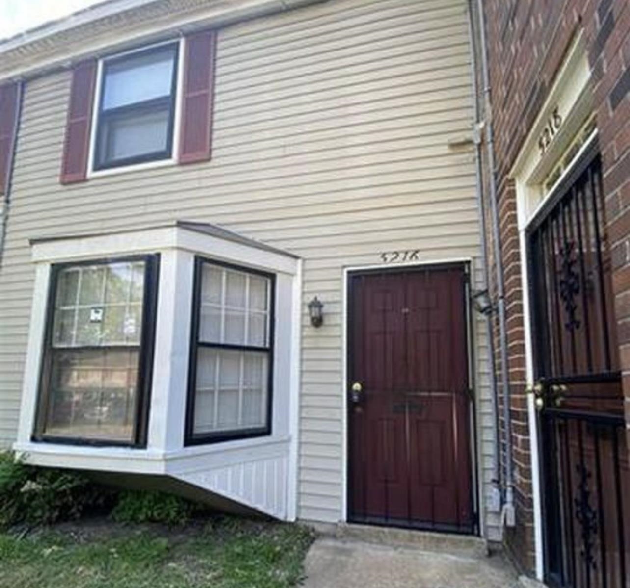 a view of brick house with front door