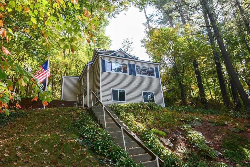 a house that has tree in front of it