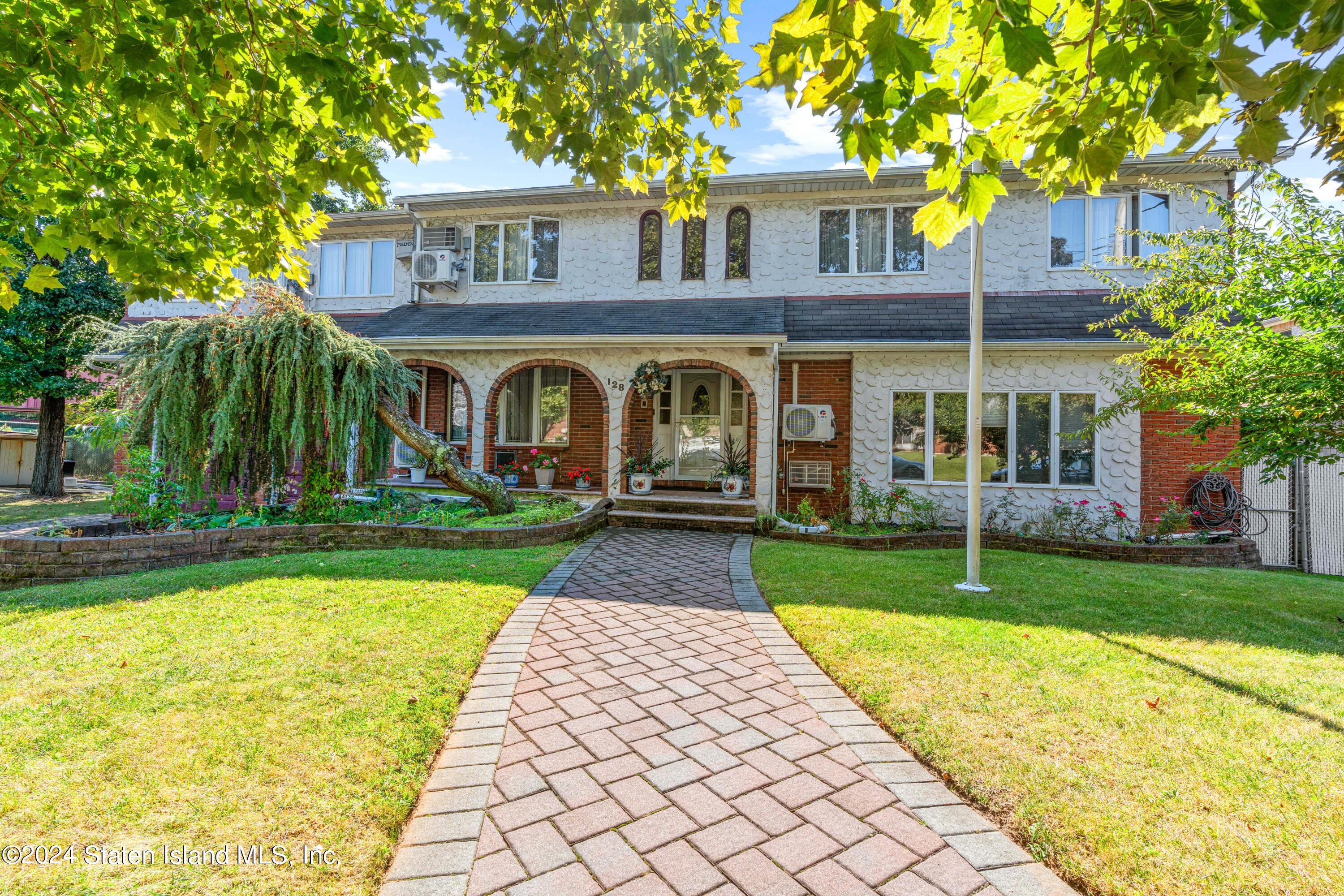 front view of a house with a yard