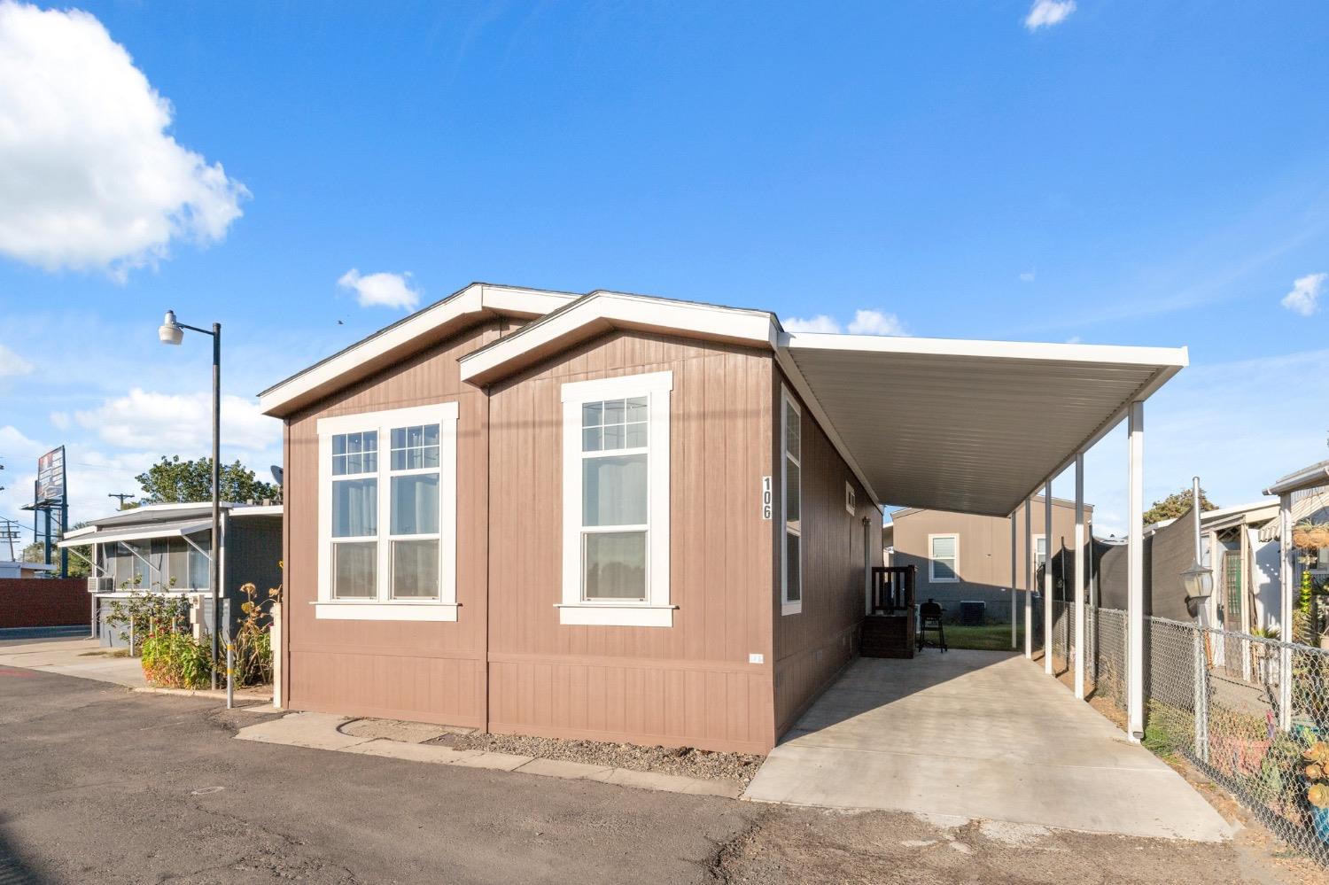 a view of a house with a backyard