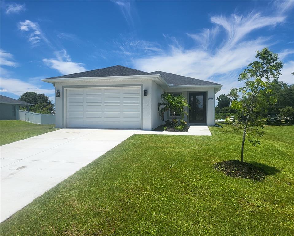 a view of a house with a backyard