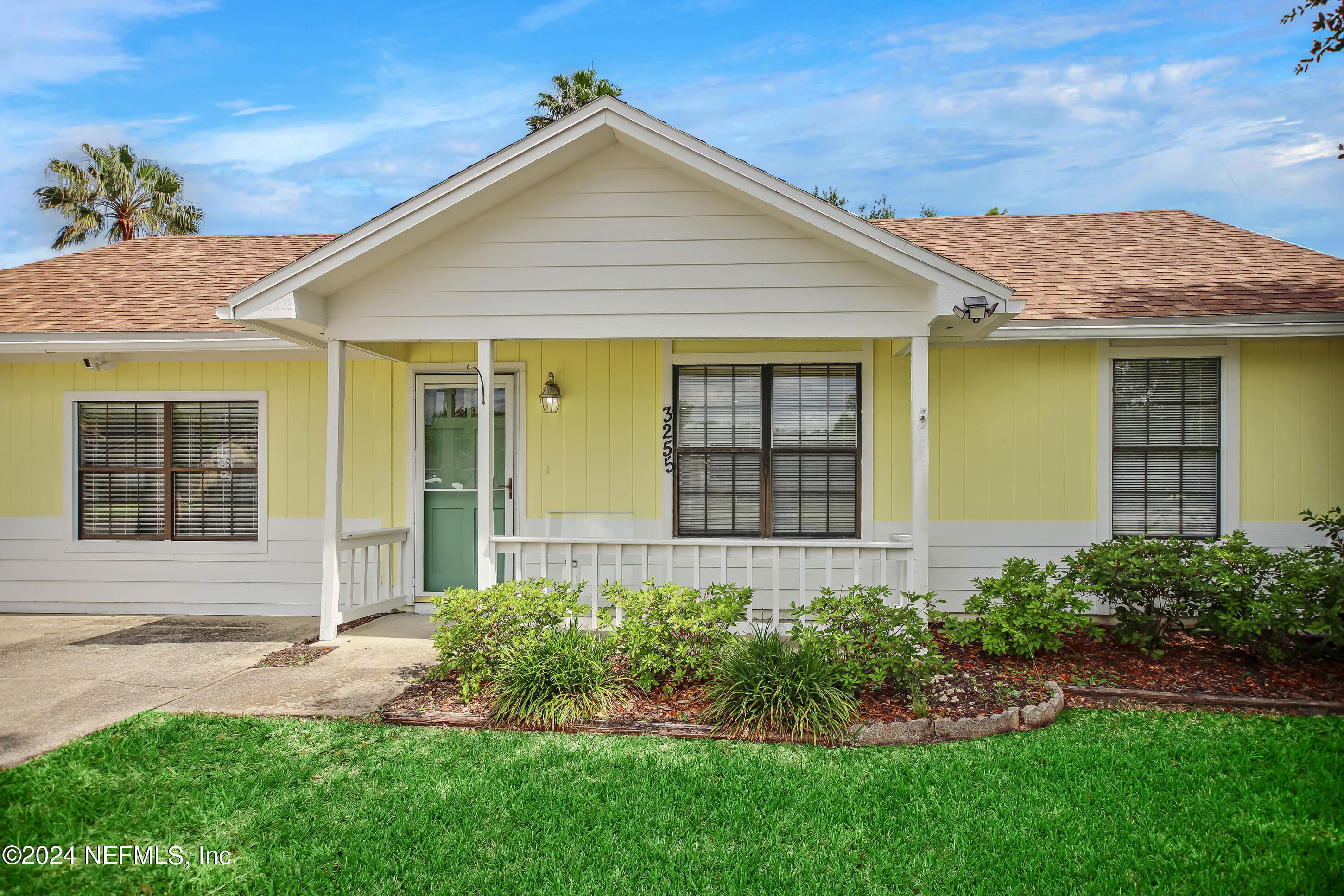 front view of a house with a yard